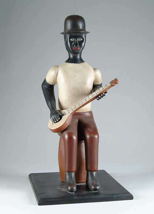 Appraisal: FOLK ART CARVED SEATED BLACK MINSTREL BY HOWARD ANDERSON th