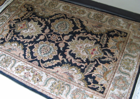 Appraisal: HAND KNOTTED ORIENTAL AREA RUG Indo-Persian floral arabesque decoration on