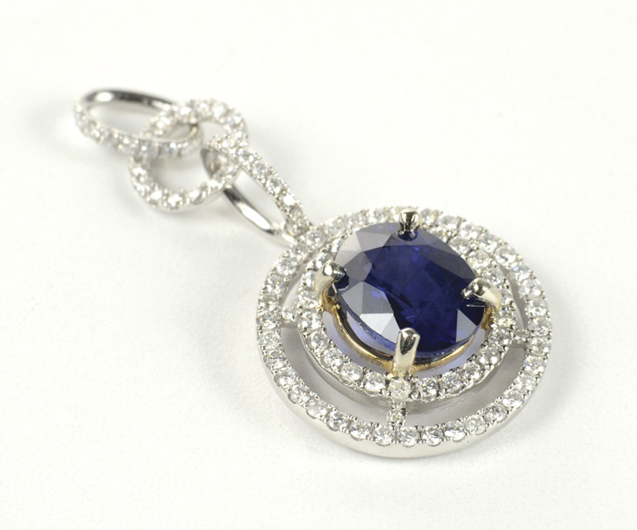 Appraisal: SAPPHIRE DIAMOND AND FOURTEEN KARAT GOLD PENDANT The white gold