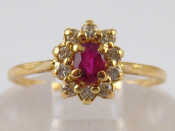 Appraisal: A yellow metal tests carat gold ruby and diamond ring