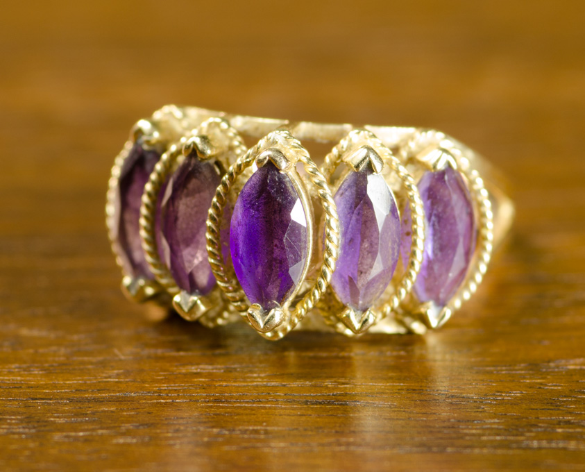 Appraisal: AMETHYST AND FOURTEEN KARAT GOLD RING set with five marquise-cut