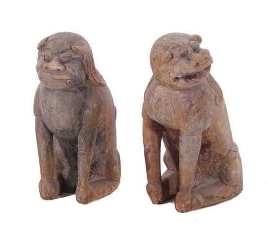 Appraisal: Pair Chinese paint-decorated carved wood temple guardians Qing dynasty seated