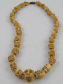 Appraisal: A row of th century graduated ivory beads cm long