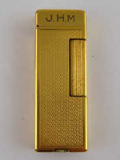 Appraisal: A Dunhill gold plated Rollalite petrol lighter in original box