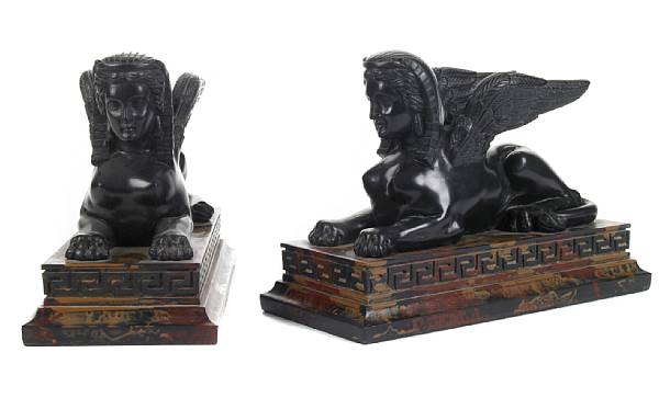 Appraisal: A pair of faux marble models of sphinx height in