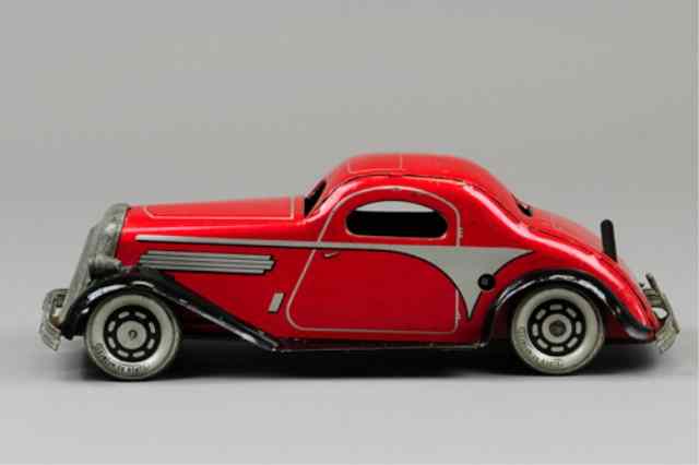 Appraisal: MARX COUPE Lithographed red in heavy tinplate black fenders nickel