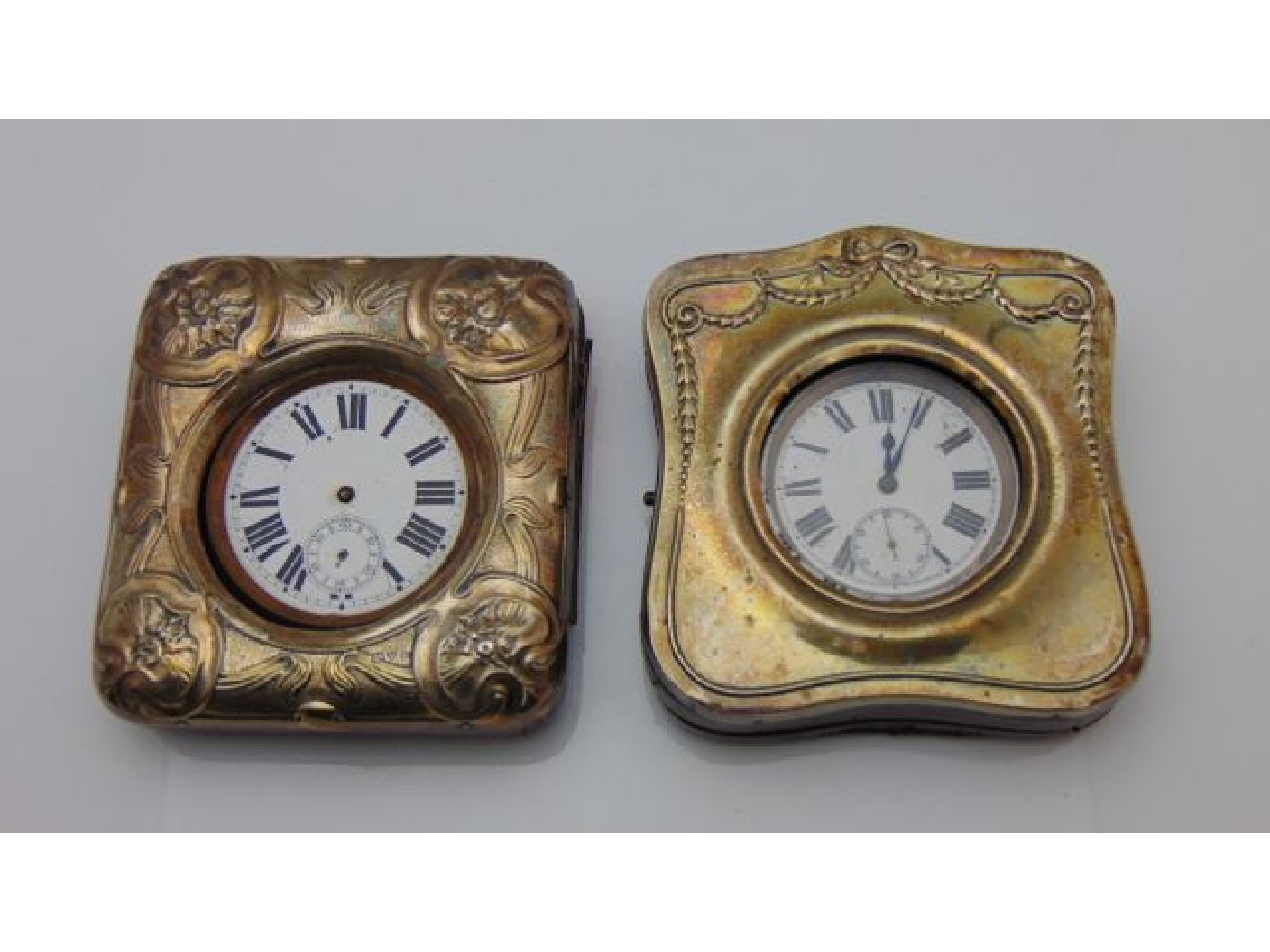 Appraisal: A silver fronted travel case with Goliath pocket watch Henry