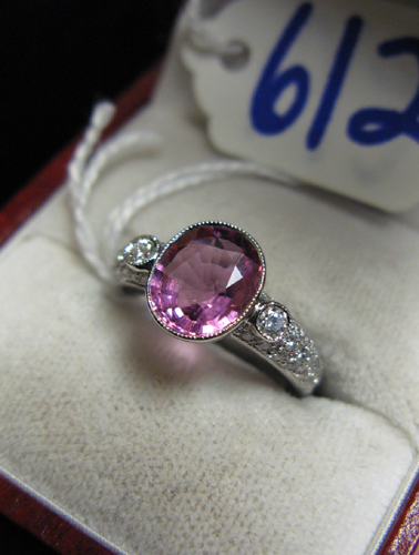 Appraisal: PINK TOURMALINE DIAMOND AND EIGHTEEN KARAT WHITE GOLD RING centering