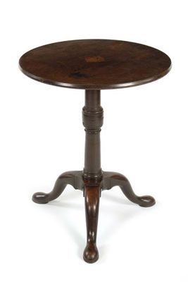 Appraisal: A mahogany tripod table the circular tilt-top on a turned