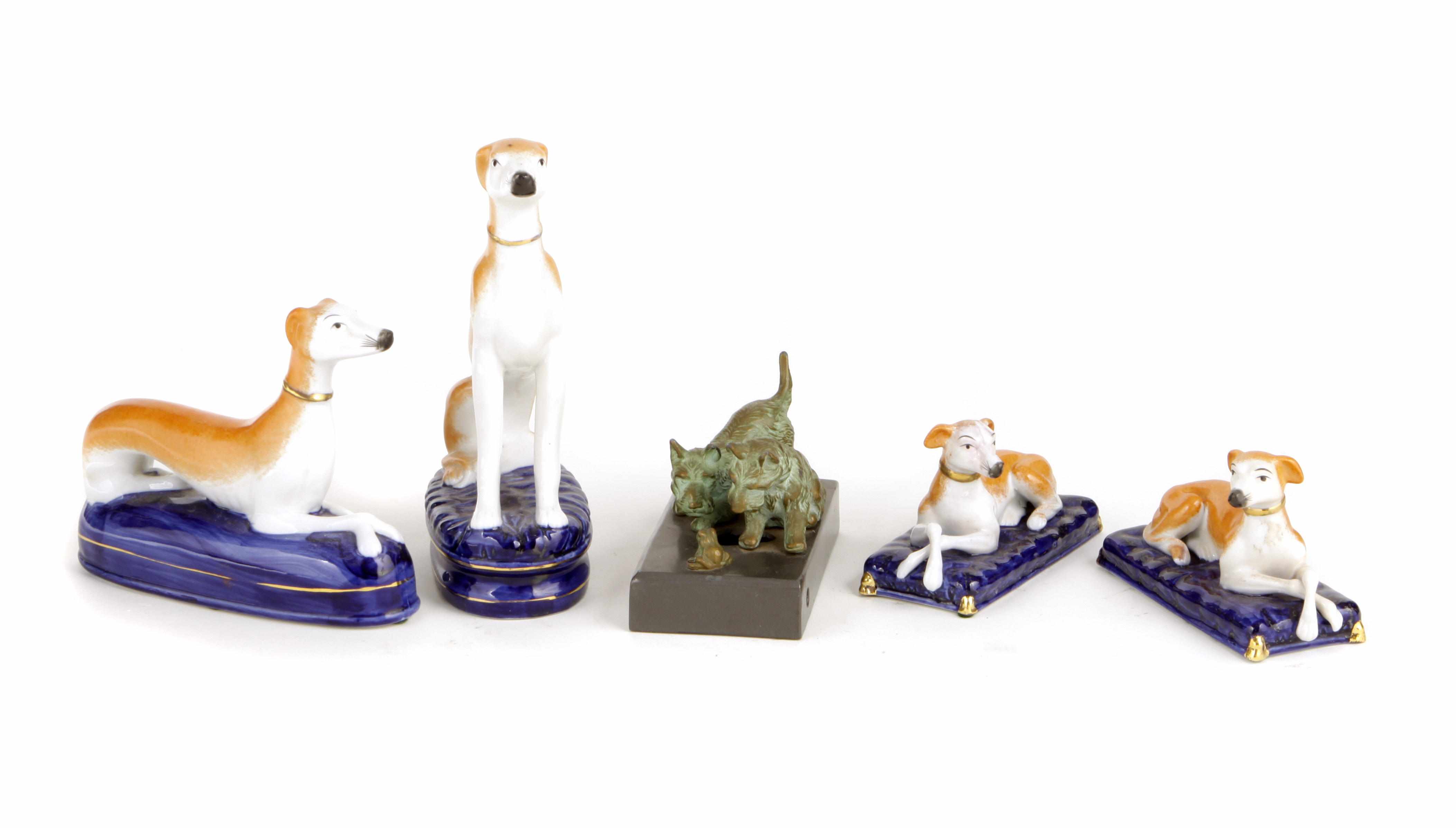 Appraisal: A group of four porcelain models of dogs Together with