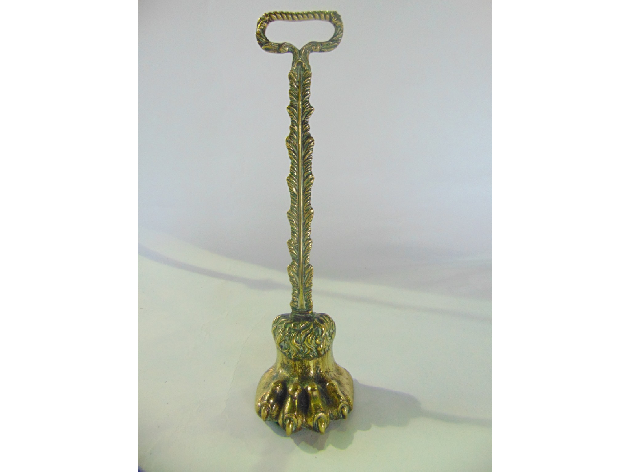 Appraisal: A good quality th century brass door stop in the