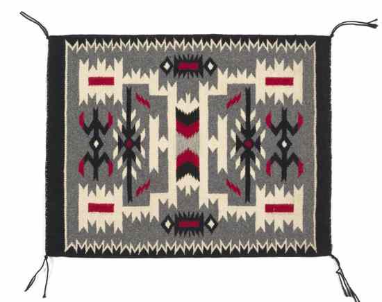 Appraisal: A Navajo Weaving Gallop Throw having a white serrated diamond