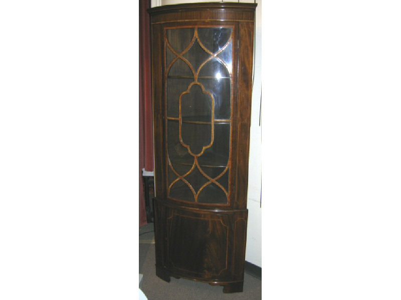 Appraisal: ENGLISH TH CENTURY MAHOGANY CORNER CABINET With convex front showing