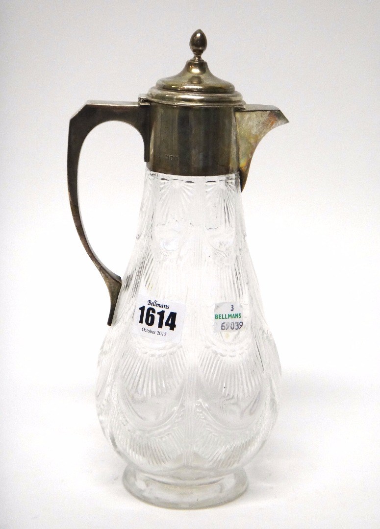 Appraisal: A silver mounted faceted glass claret jug the body of