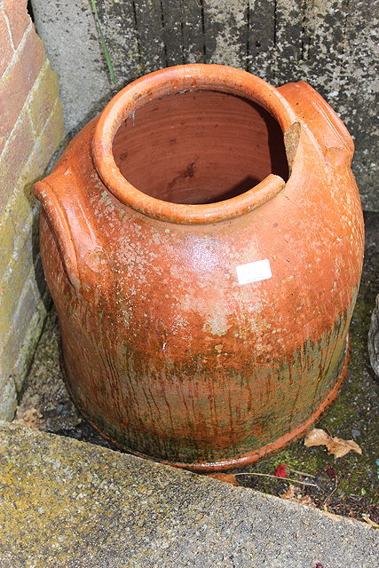 Appraisal: A PAIR OF OLD TERRACOTTA RHUBARB FORCERS with molded handles