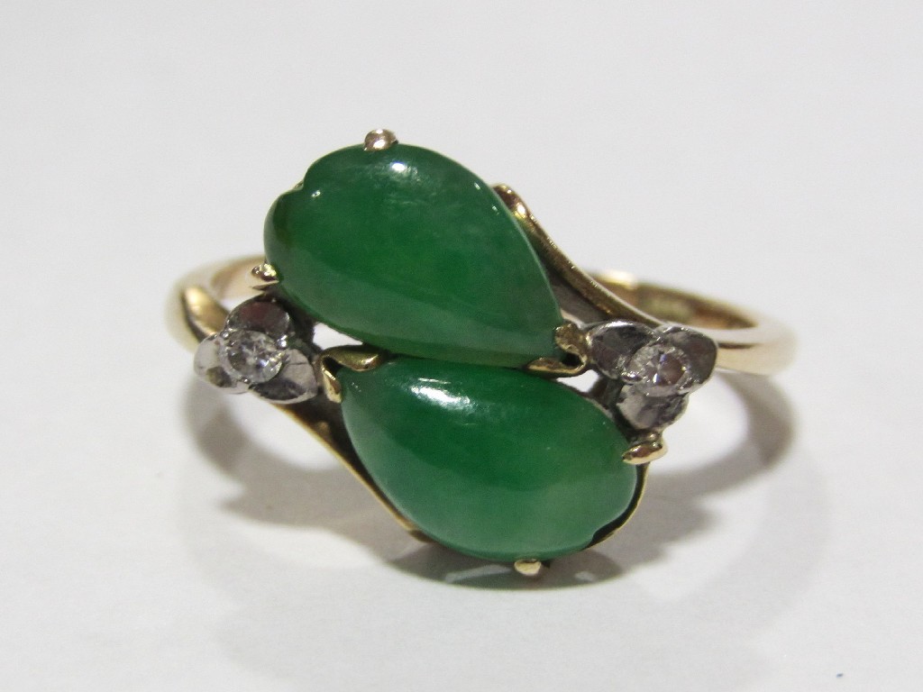 Appraisal: Fourteen carat yellow gold jade and diamond set dress ring