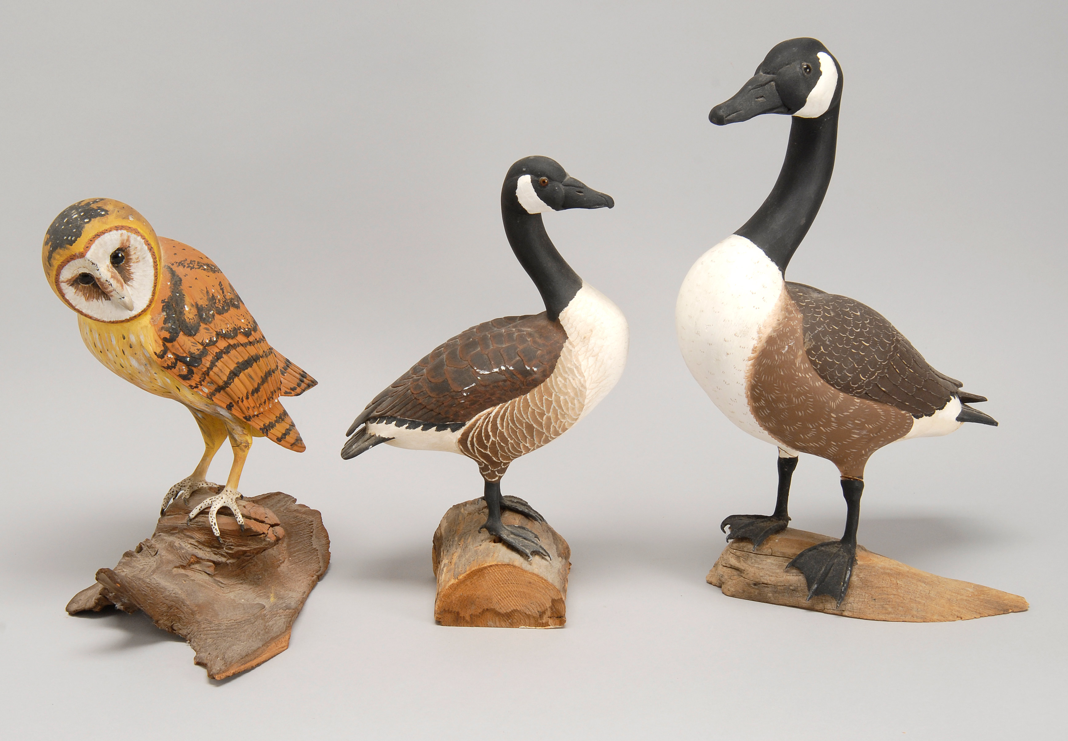 Appraisal: THREE MINIATURE BIRD CARVINGS Two geese and a barn owl