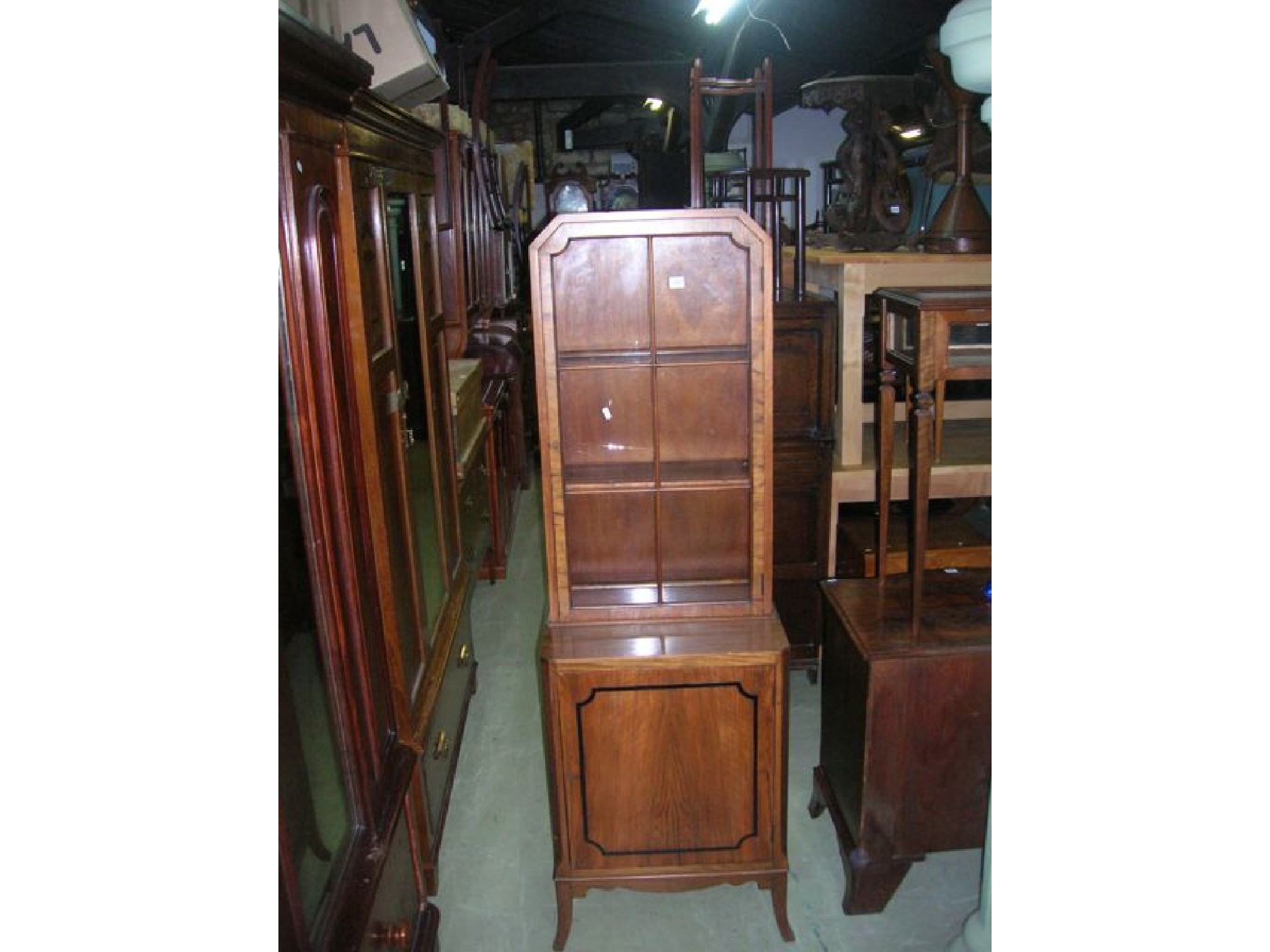 Appraisal: A small walnut veneered freestanding side display cabinet the upper