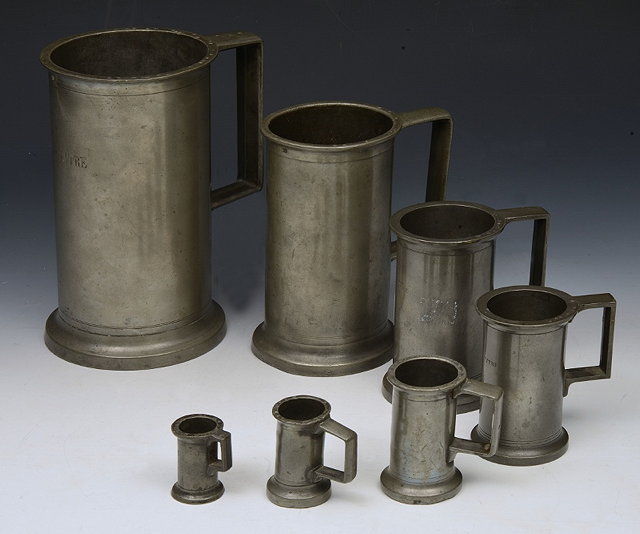 Appraisal: A GRADUATED SET OF SEVEN METRIC CYLINDRICAL PEWTER MEASURES