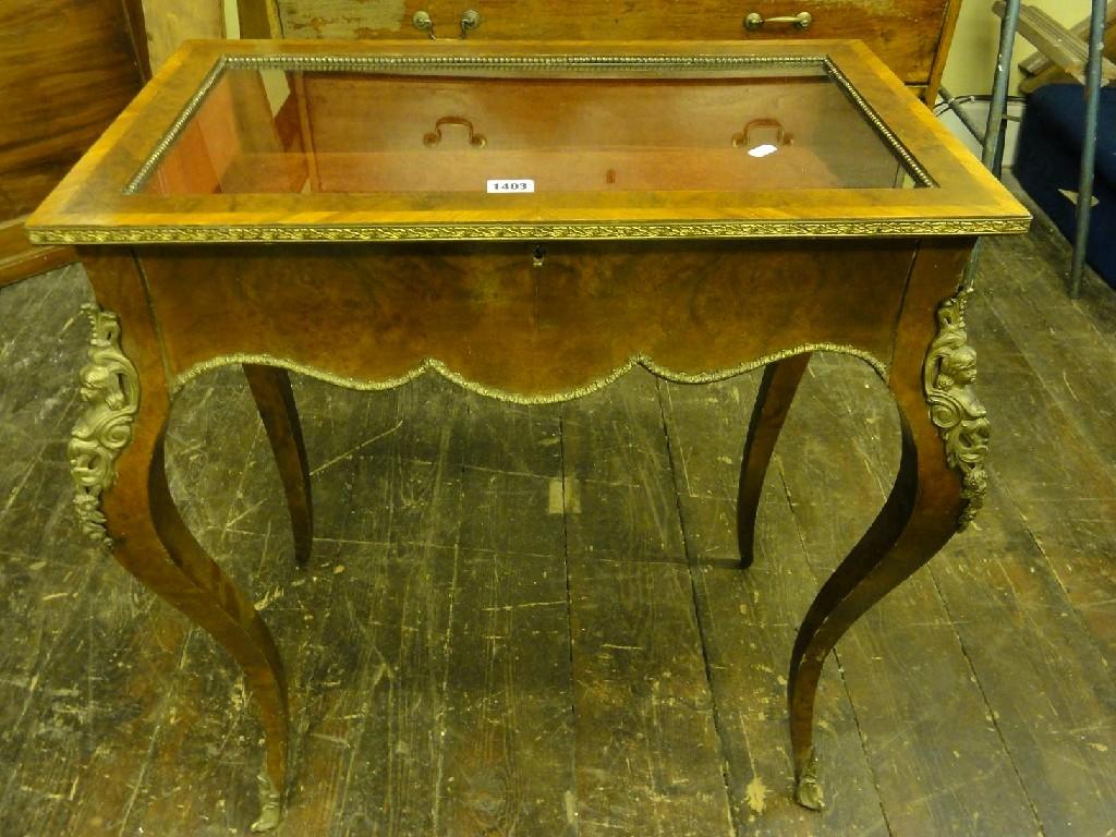 Appraisal: A continental burr and figured walnut veneered vitrine of rectangular