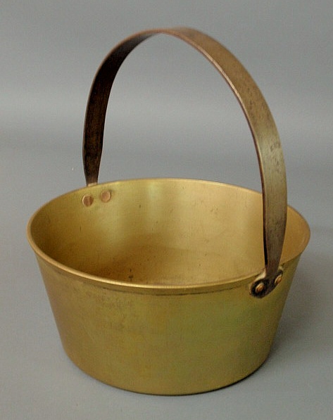 Appraisal: Spun brass pot with iron handle h x dia