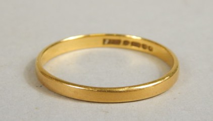 Appraisal: A ct gold wedding band of plain outline g