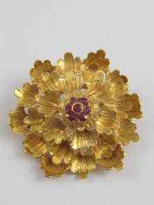 Appraisal: An ct gold brooch of floral design the centre set