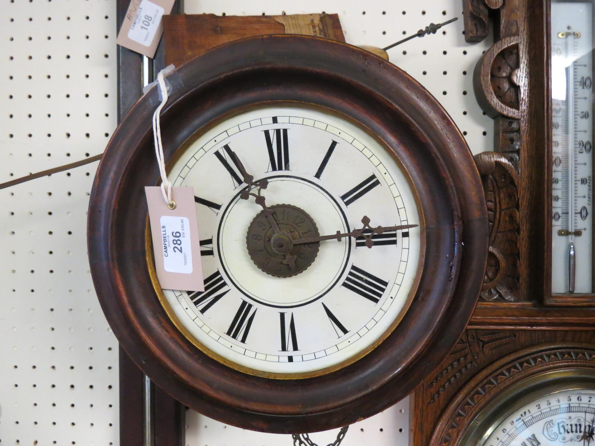 Appraisal: A Victorian dial clock in enamelled dial with alarum -hour