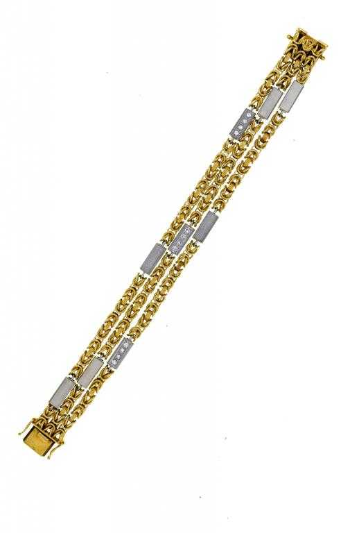 Appraisal: A GOLD BRACELET composed of three chains with white gold