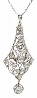 Appraisal: Platinum and Diamond Pendant Edwardian filigree pendant accented with milgrain