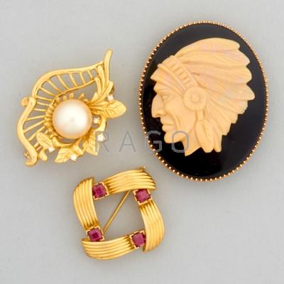 Appraisal: THREE JEWELED GOLD BROOCHES th C k gold square ribbon