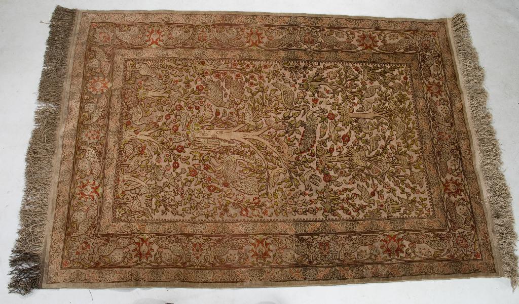 Appraisal: ORIENTAL SILK RUG worked with birds amongst trees within a