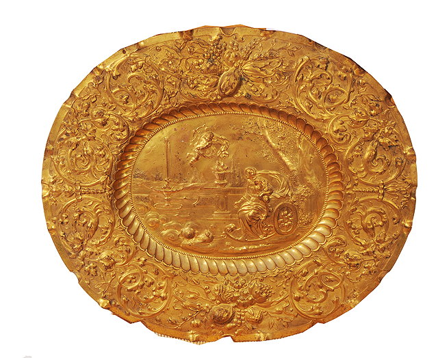 Appraisal: A CONTINENTAL GILT METAL OVAL REPOUSSE PLAQUE in the Baroque