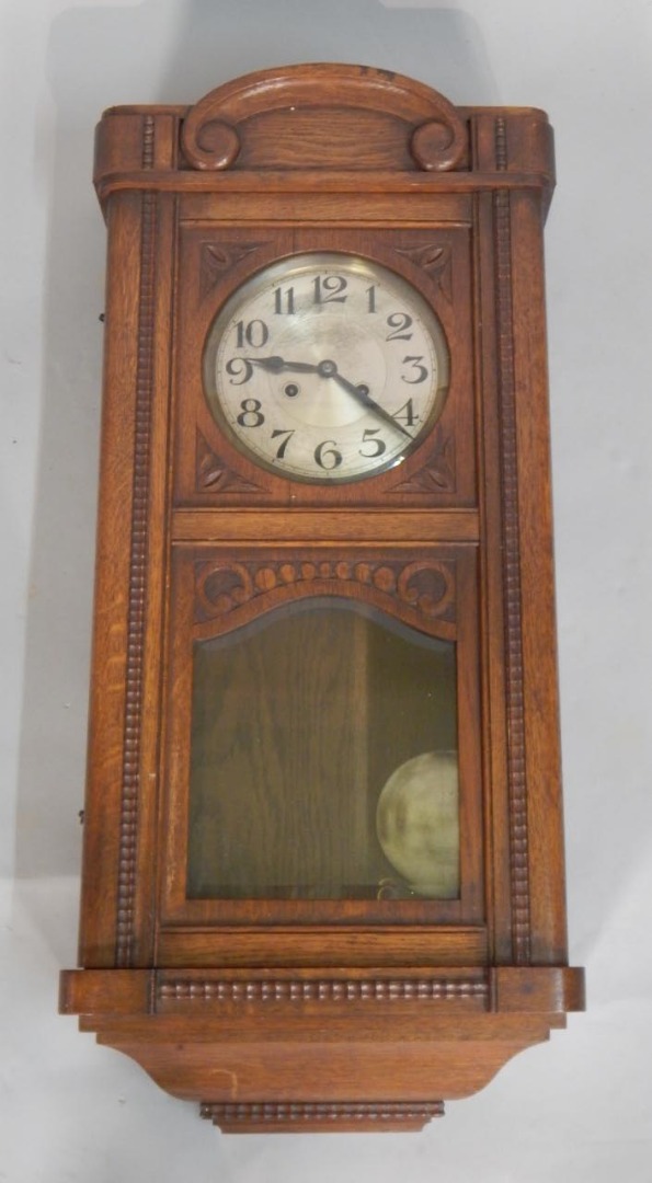 Appraisal: An early thC German wall clock in carved oak case