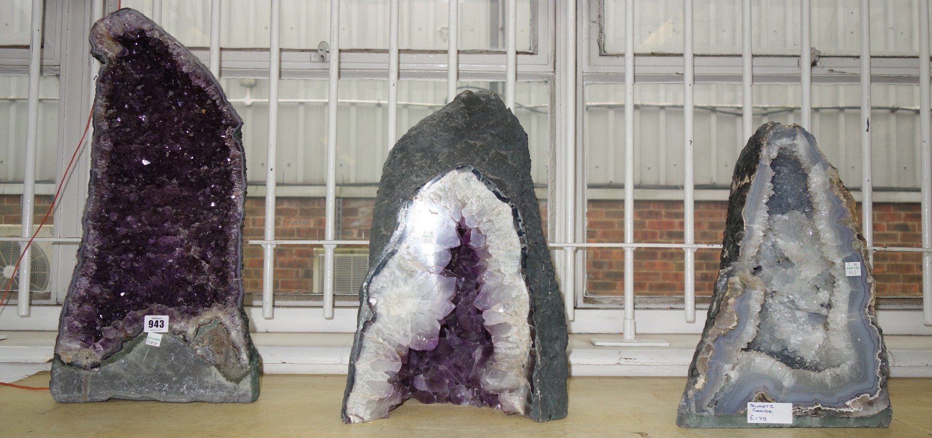 Appraisal: Three amethyst quartz geodes of typical naturalistic form the largest