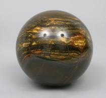 Appraisal: A Large Tiger Eye Sphere With thick marking running through