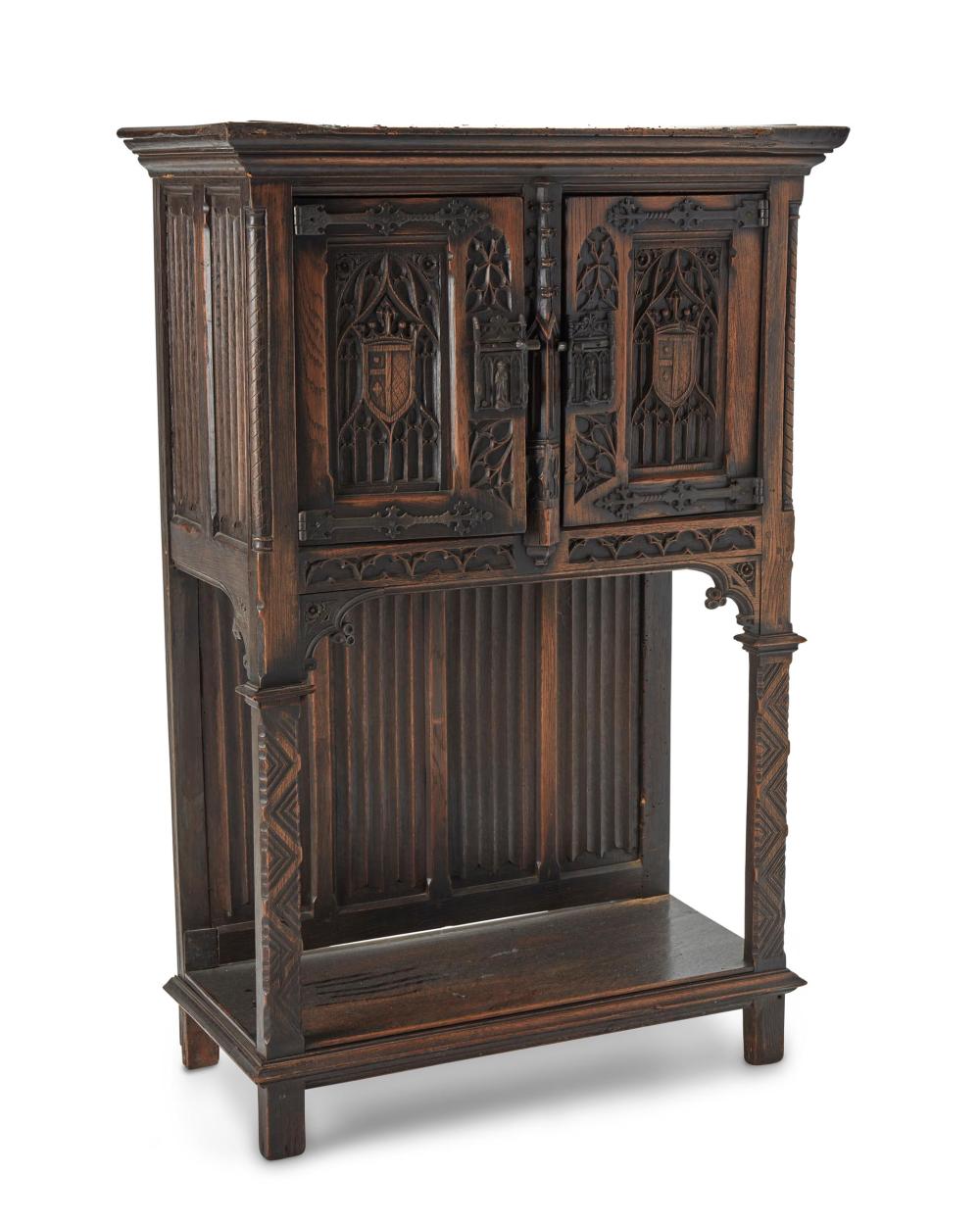 Appraisal: An English Gothic Revival carved wood court cupboard Fourth-Quarter th