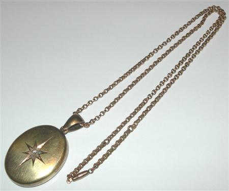 Appraisal: A Victorian diamond set locket with chain the plain oval