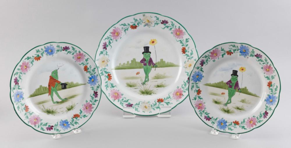 Appraisal: THREE HAND-PAINTED PORCELAIN PLATES FEATURING A LOVELORN FROG Early th