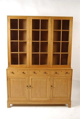 Appraisal: A Heal Son limed oak sideboard with glazed display book