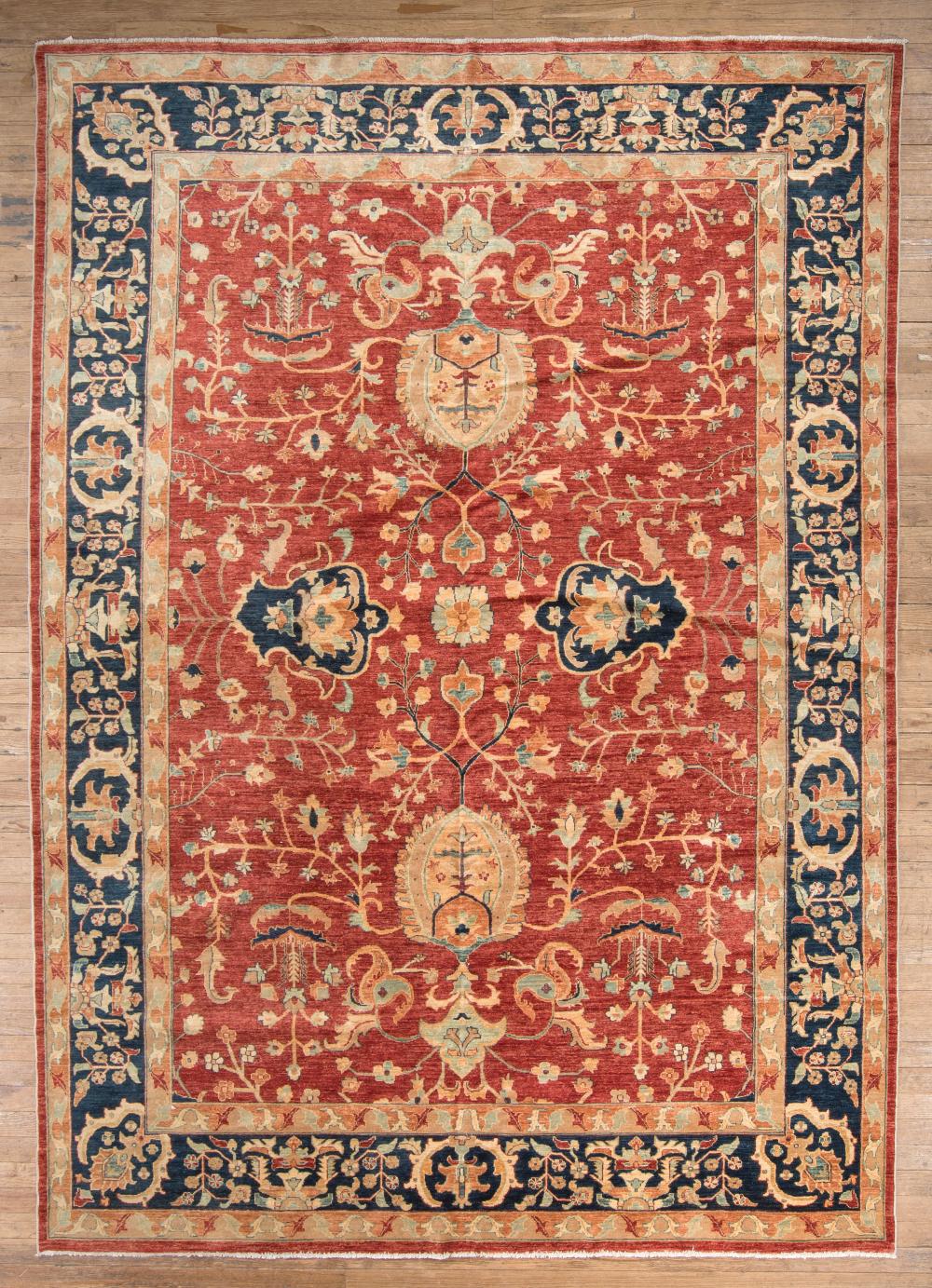 Appraisal: Persian Carpet crimson ground blue border overall floral design ft