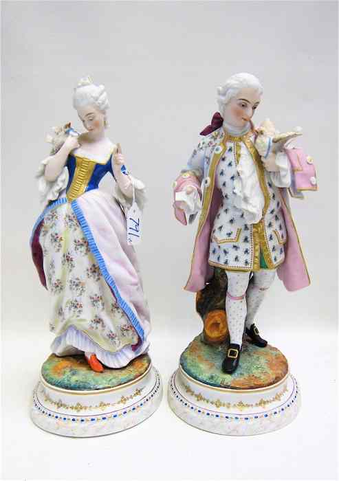 Appraisal: PAIR OF HAND PAINTED BISQUE FIGURINES a male and a