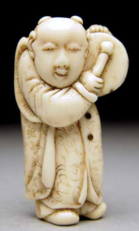 Appraisal: ANTIQUE IVORY NETSUKE Antique carved ivory netsuke of a karako