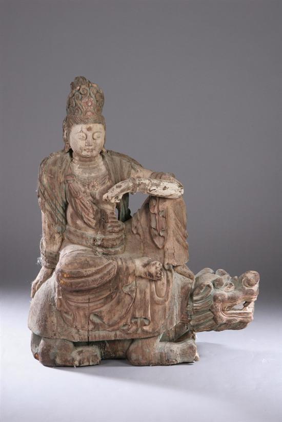 Appraisal: CHINESE POLYCHROME WOOD FIGURE OF GUANYIN AND FU LION th