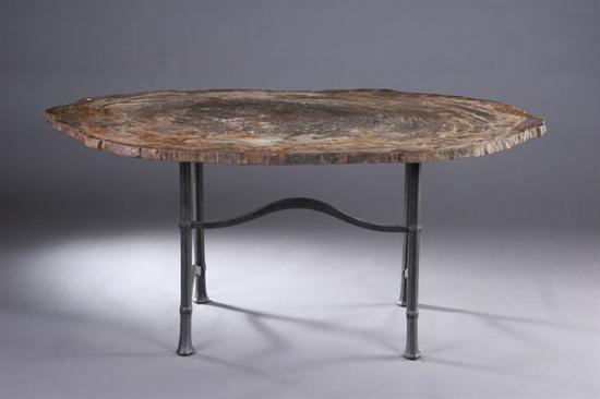 Appraisal: ARAUCARIOSYLON ARIZONICUM PETRIFIED WOOD TABLE th century Together with iron