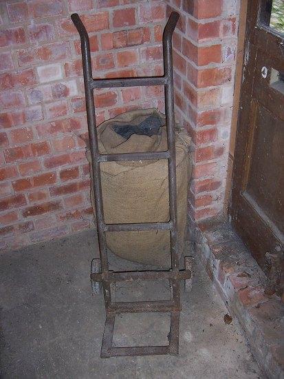 Appraisal: A wrought iron two-wheeled sack truck