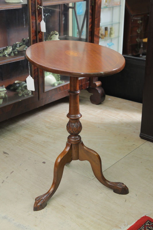 Appraisal: TILT TOP CANDLESTAND Walnut having an oval top with urn