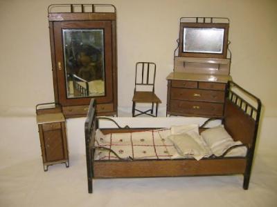 Appraisal: A suite of Bruno Ulbricht doll's house furniture comprising oak