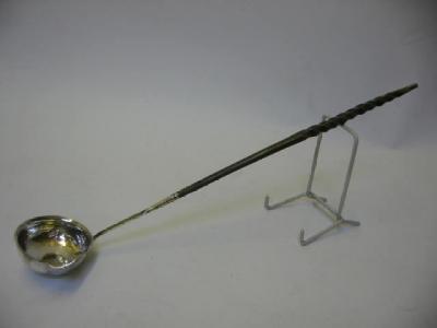 Appraisal: A GEORGE III PUNCH LADLE the unmarked oval lipped bowl