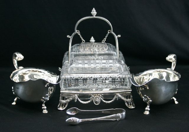 Appraisal: A silver plate and cut crystal pickles cruet together with